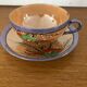 Coffee cup and under cup or tea made of iridescent Japanese porcelain