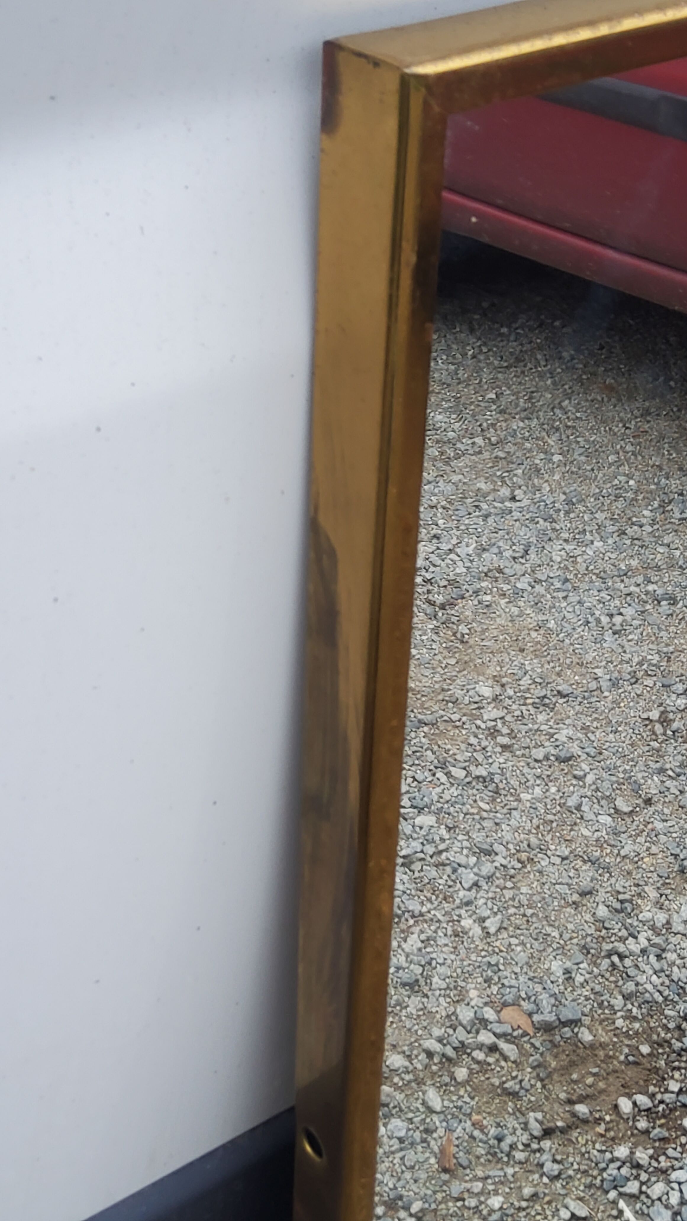 Mirror of the 70s in gilded metal, 60x35 cm