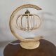 Lampe à poser en rotin formant une lune style Louis Sognot
