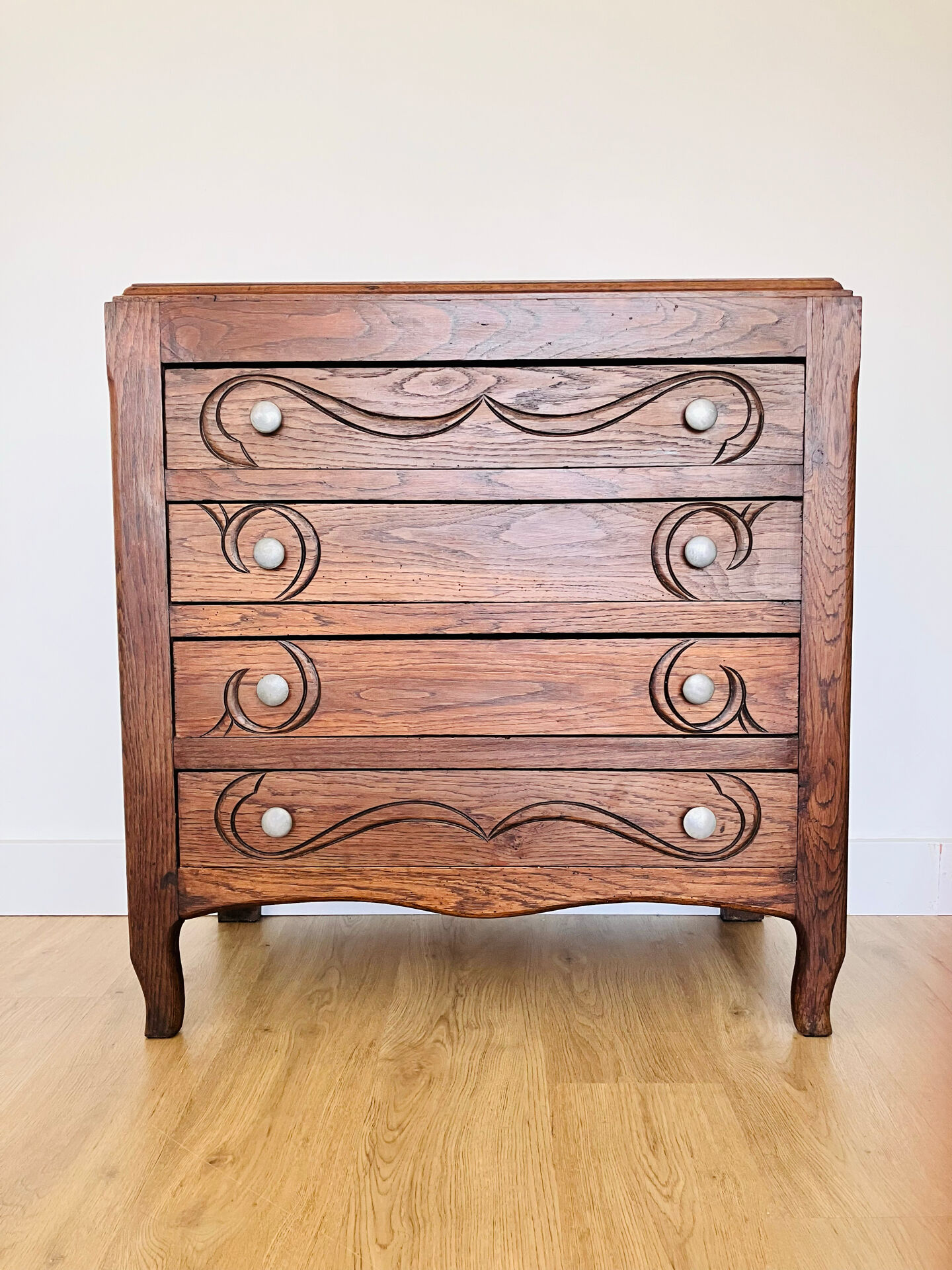 Antique commode with carved relief