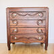 Antique commode with carved relief