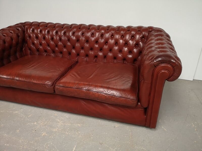 Old red leather Chesterfield sofa