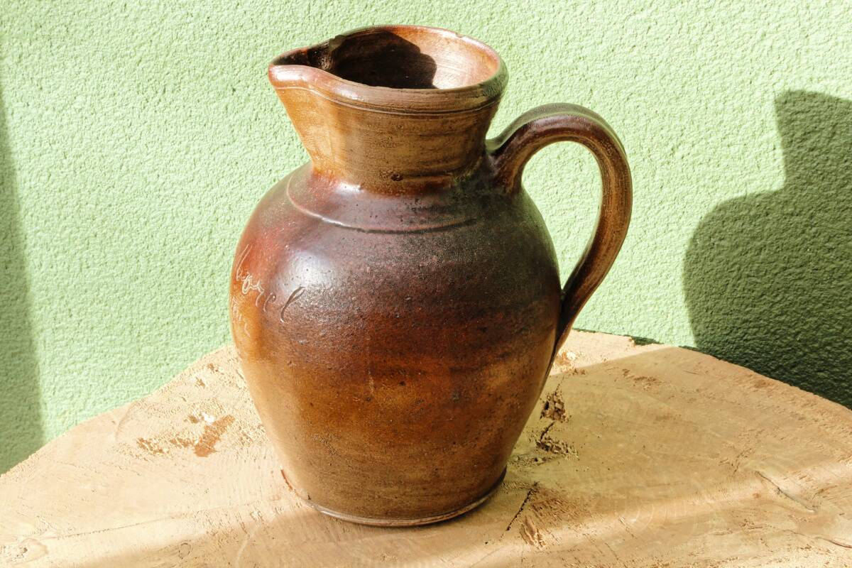 Large stoneware jug with a family name pattern, 1912