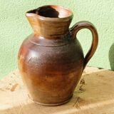 Large stoneware jug with a family name pattern, 1912