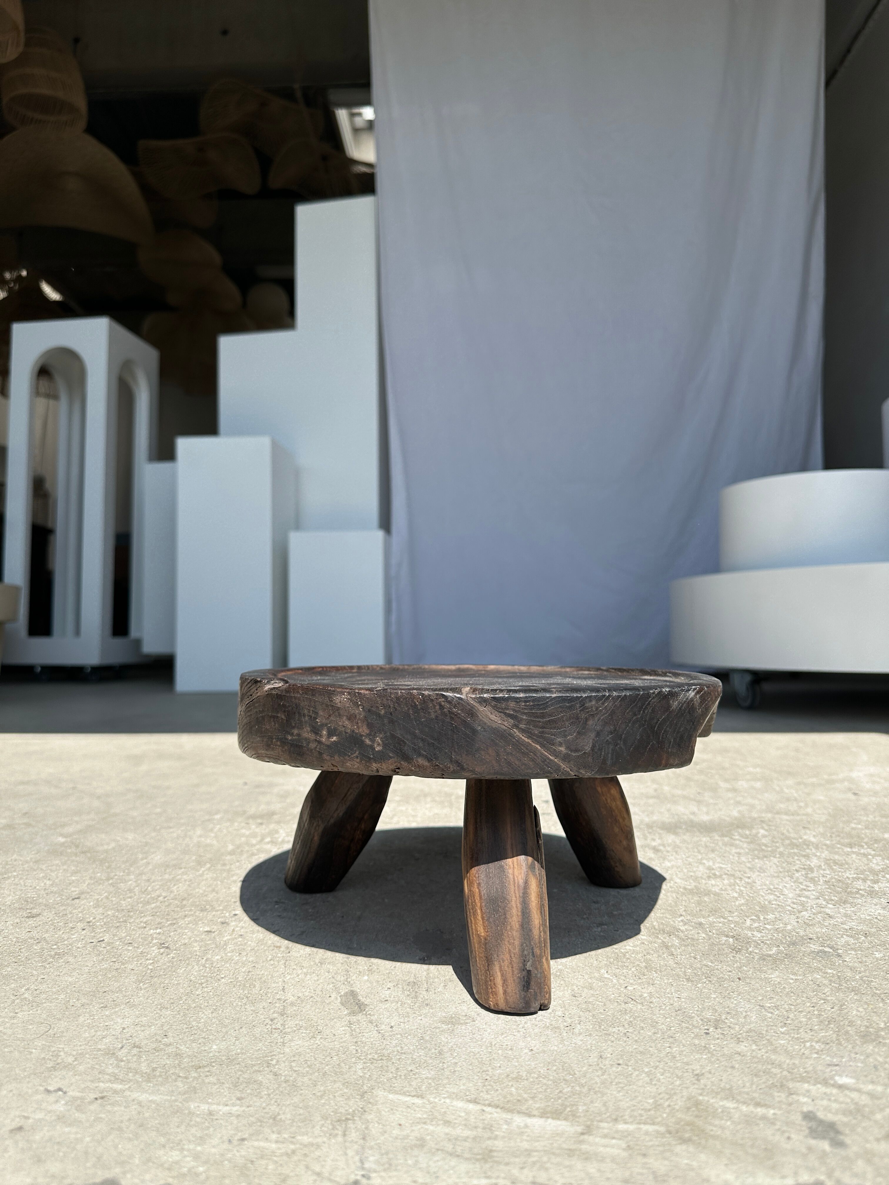Small tripod stool low in dark brown upcycled teak