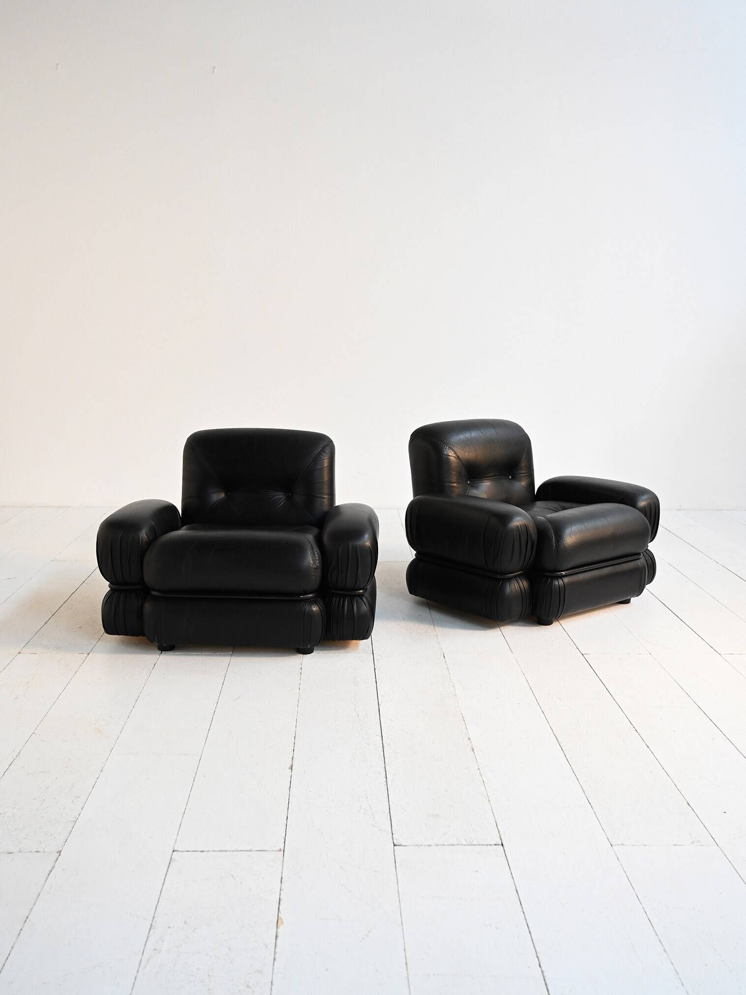 Black leather and tubular steel armchairs, 1970s