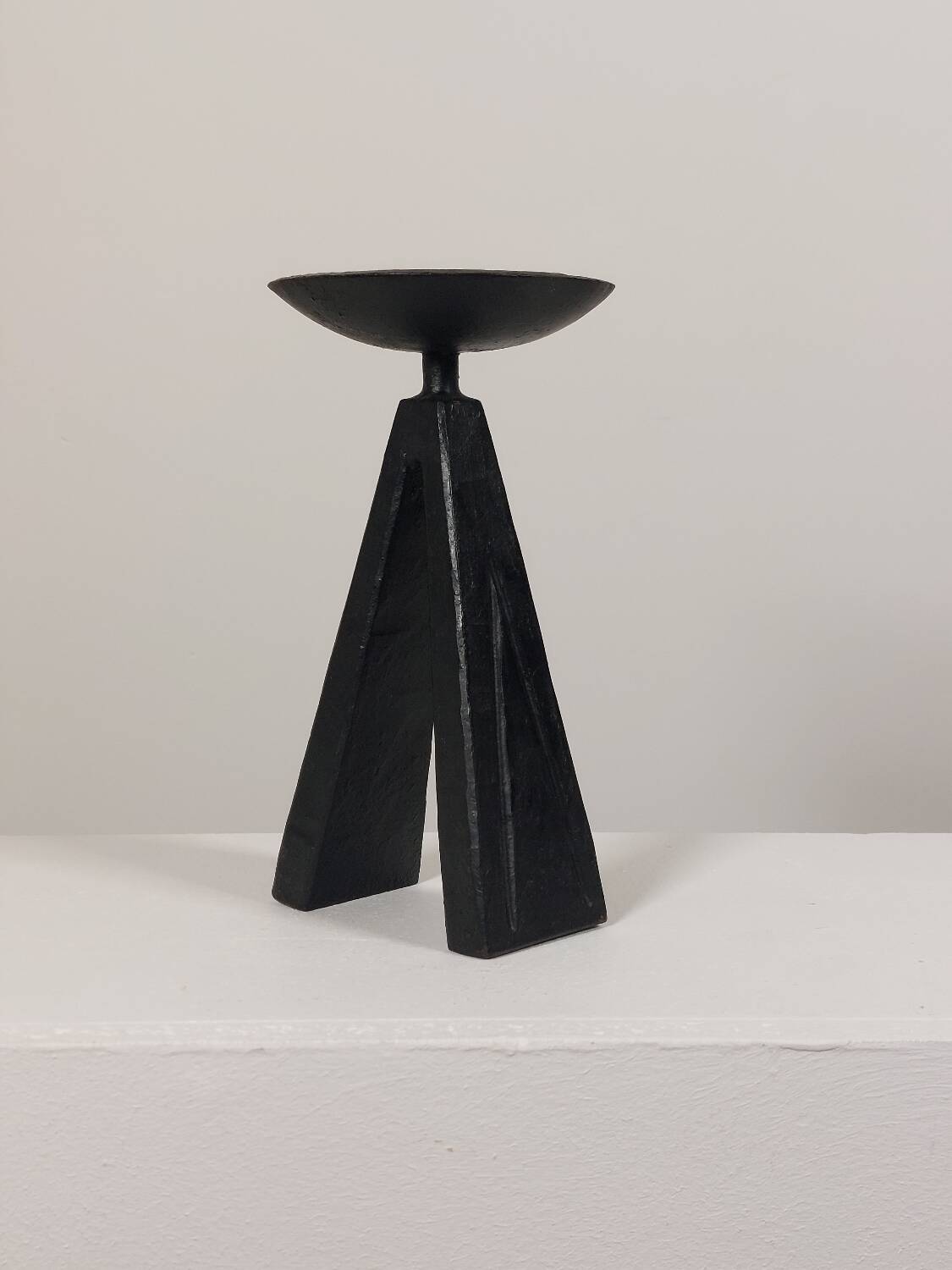 Vintage candle holder made of hand-forged metal, in a brutalist style.