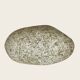 A lamp in the shape of a pebble.
