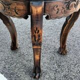 Old wooden saddle pedestal table with claw feet