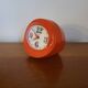 Vintage mechanical alarm clock in orange plastic Uti West Germany