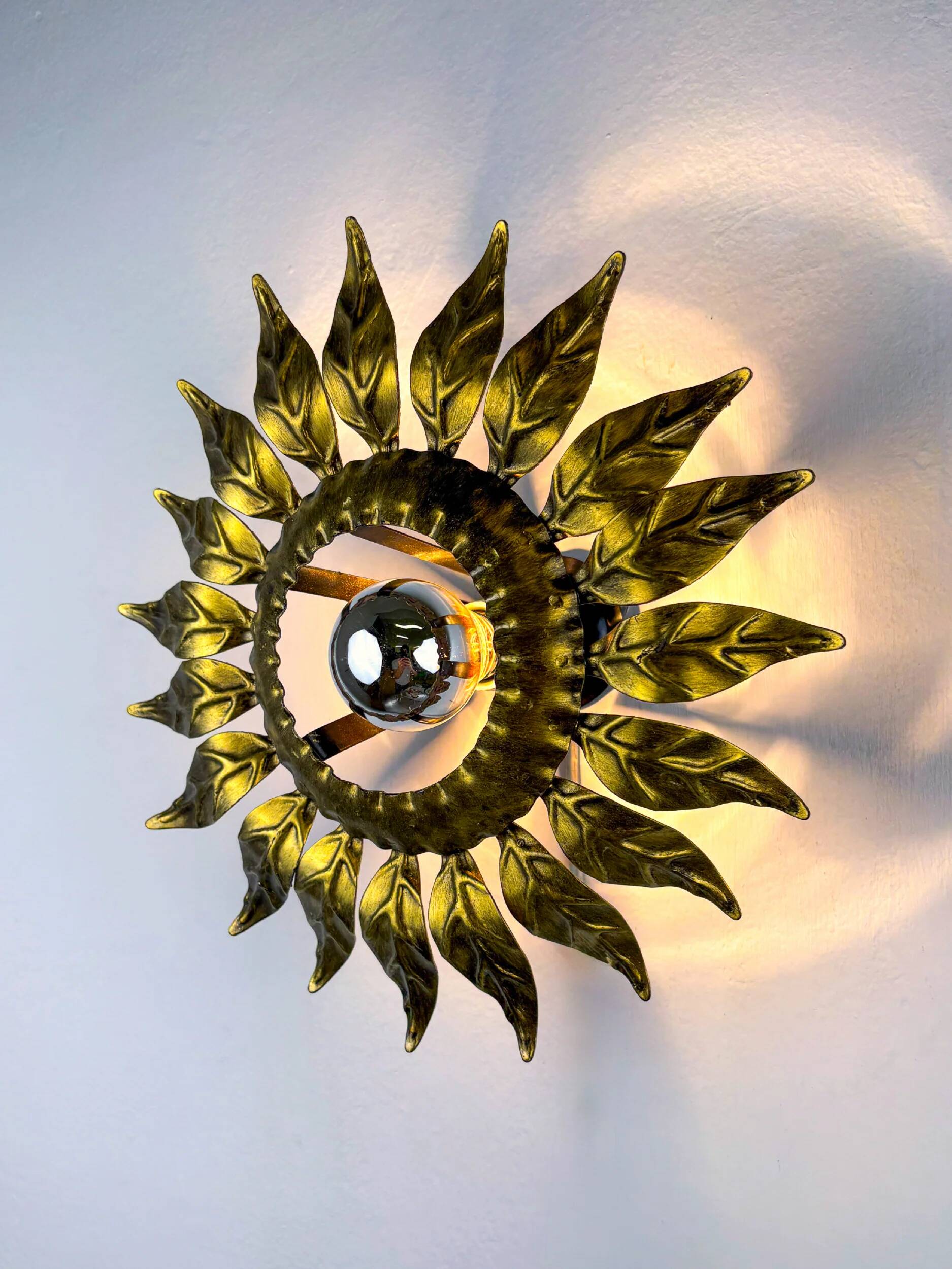 Sunburst ceiling light fixture or sconce in gilt wrought iron, Spain, circa 1960s