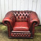 Pair of red leather chesterfield chairs