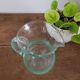 pitcher in green bubbled glass