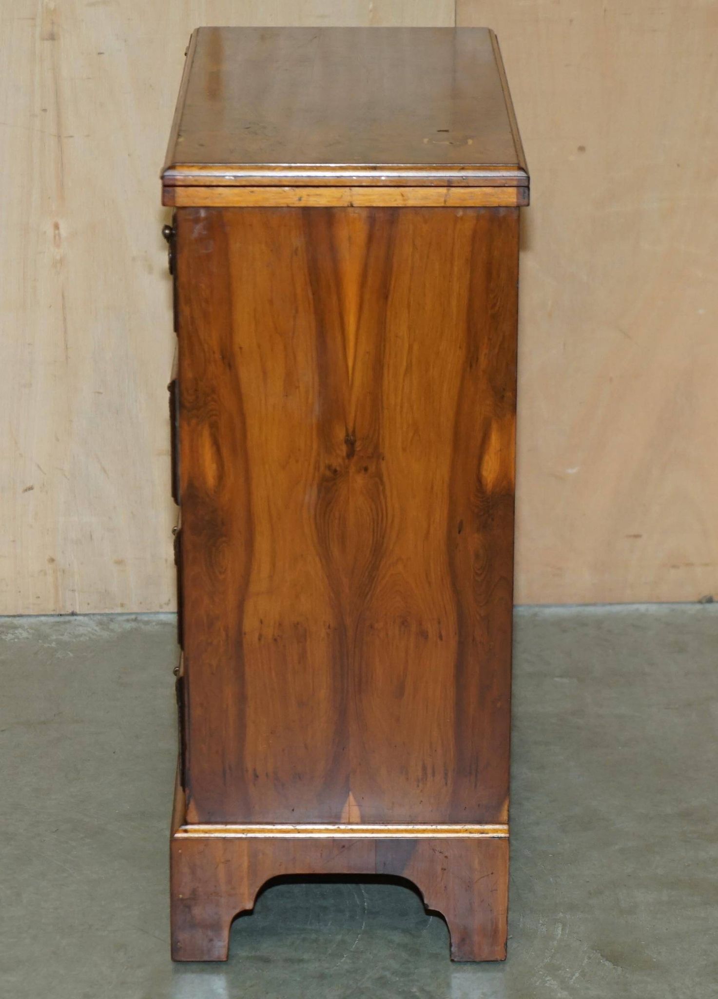 Vintage walnut commode with sliding top in Butler style.