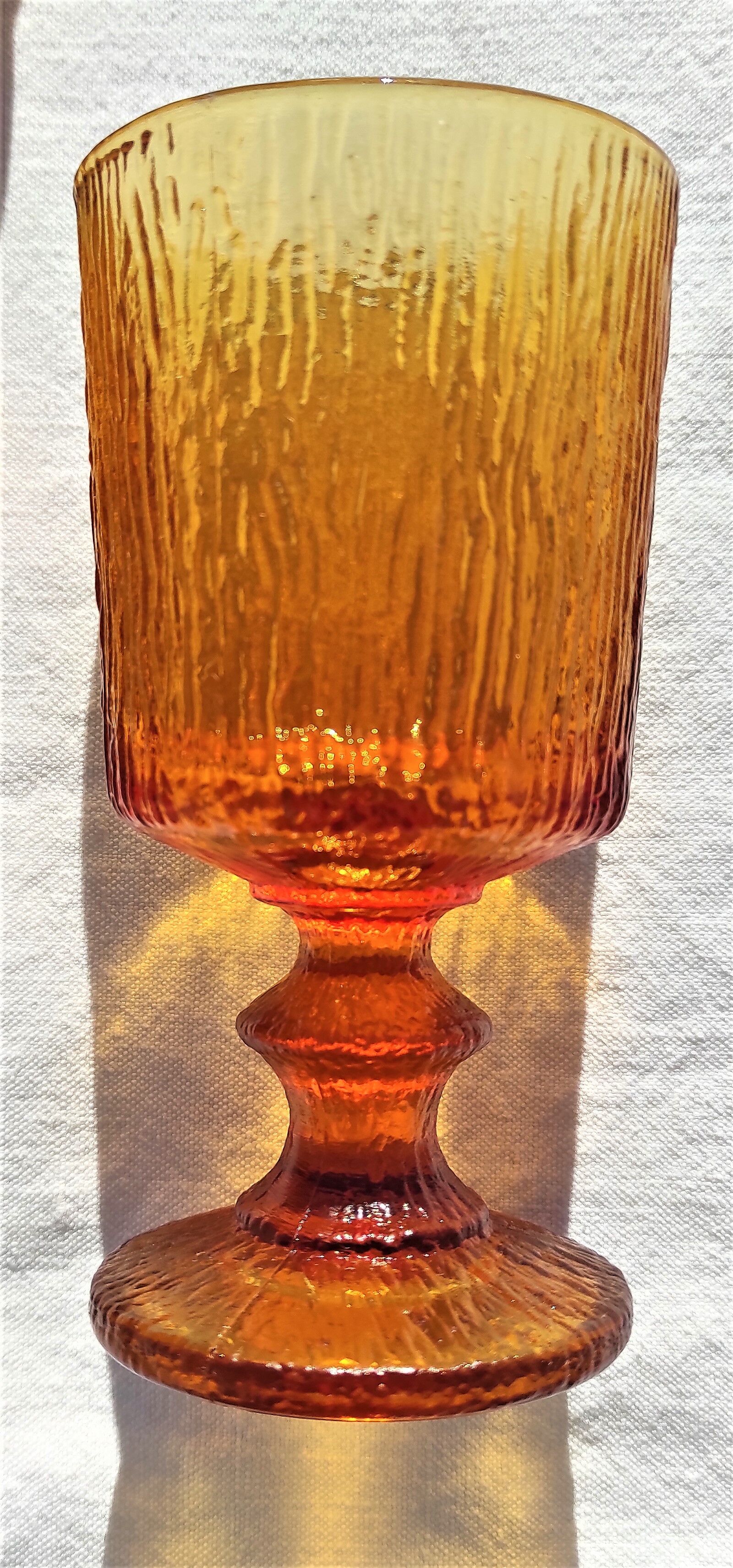 9 orange-stemmed wine glasses circa 1970