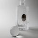 Vintage glass decanter from the 1980s, transparent glass with a silver plate and spherical stopper.