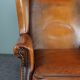 Eared armchair in patinated sheepskin