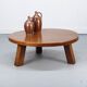 Large vintage round coffee table in raw oak brutalism.