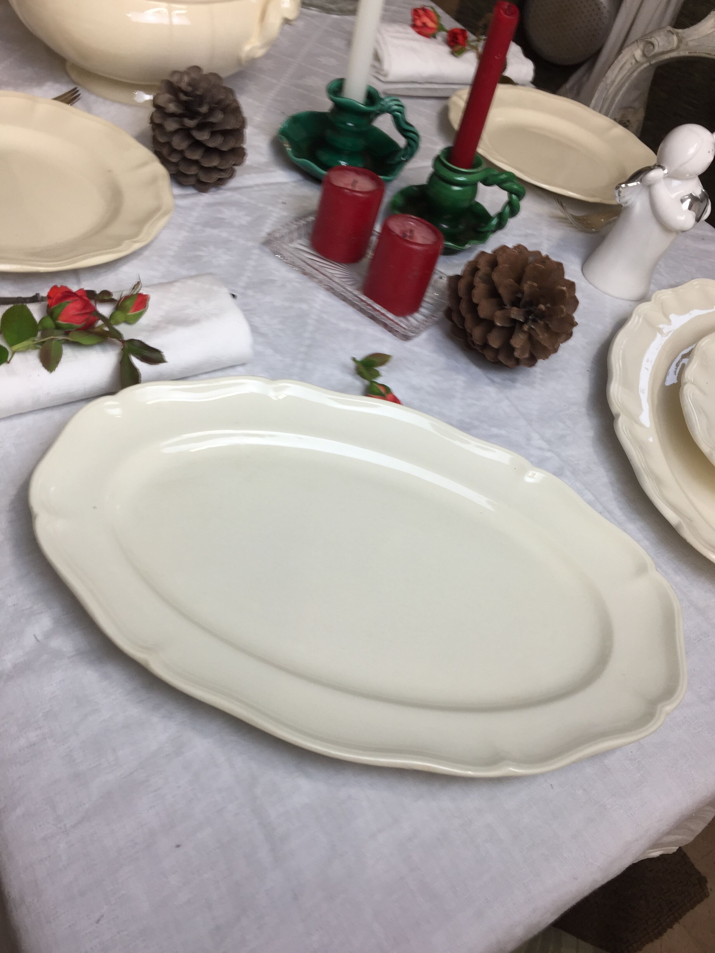 Old ivory-colored, oval-shaped dish with chamfered edge