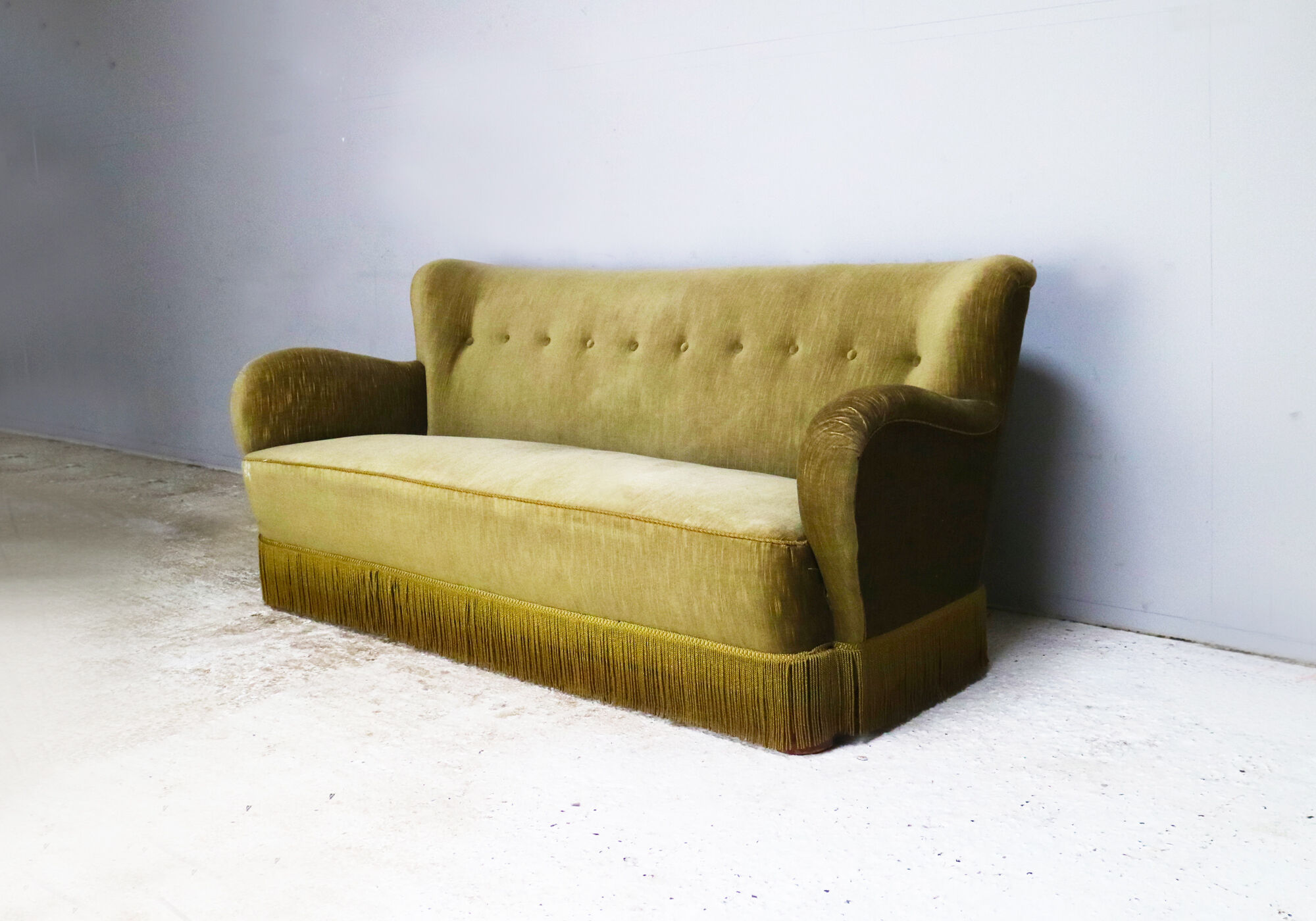 1930’s Danish sofa in green velour with fringed bottom