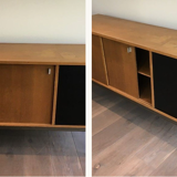 Row with double sliding doors and bar on metal base