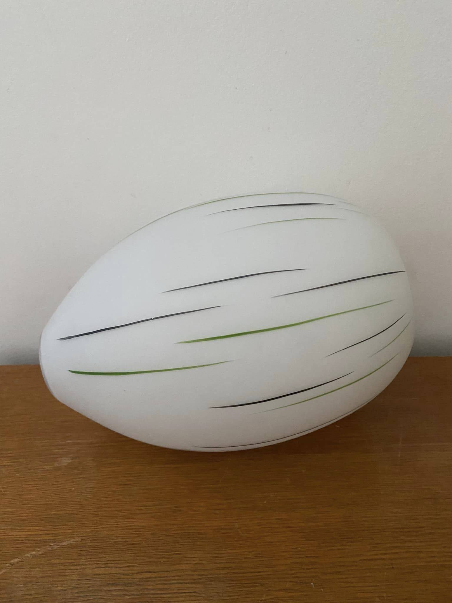White opaline tulip with dark green and gray streaks. Oblong shape.