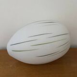 White opaline tulip with dark green and gray streaks. Oblong shape.