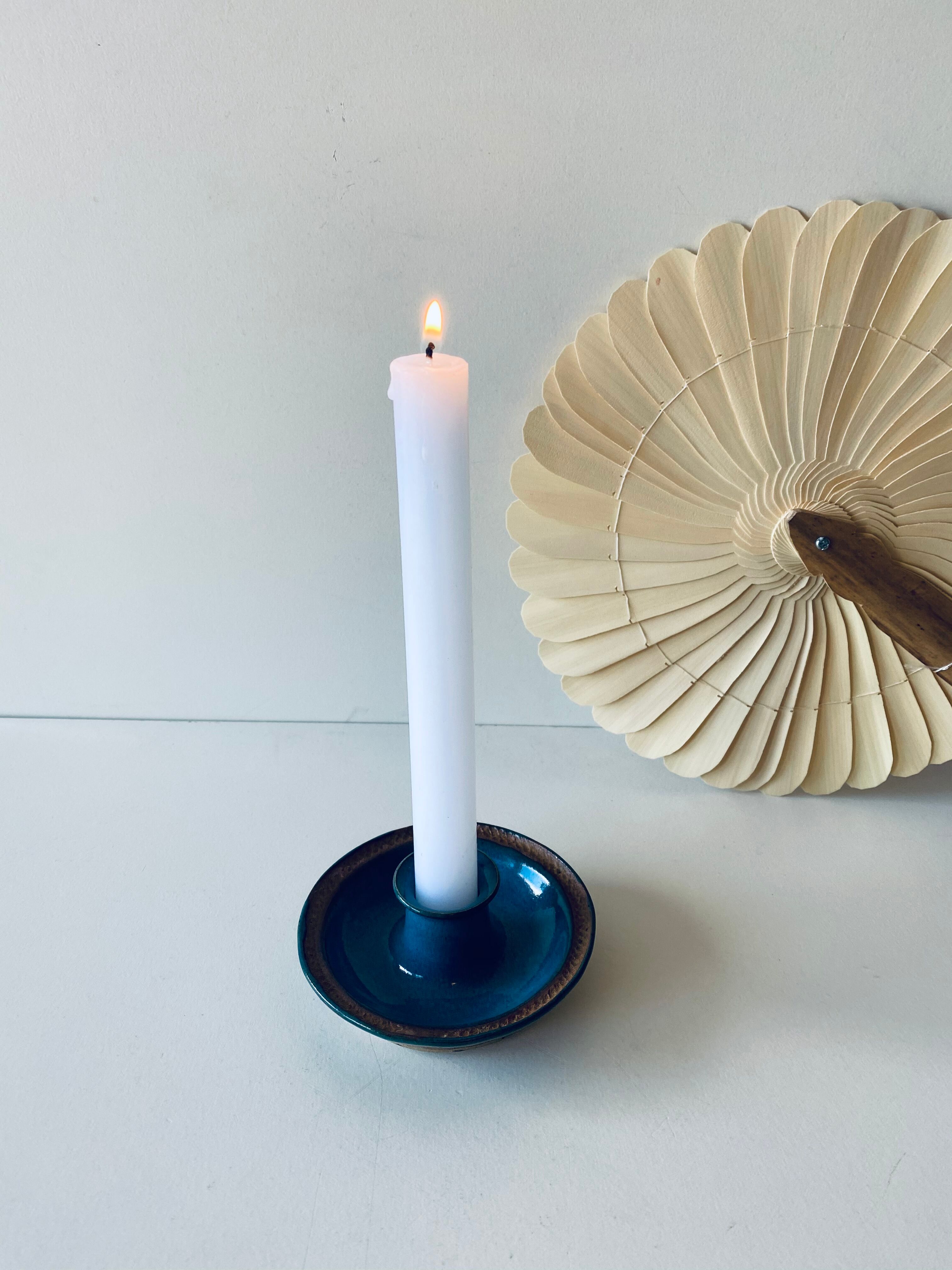 Blue enamelled sandstone candlestick