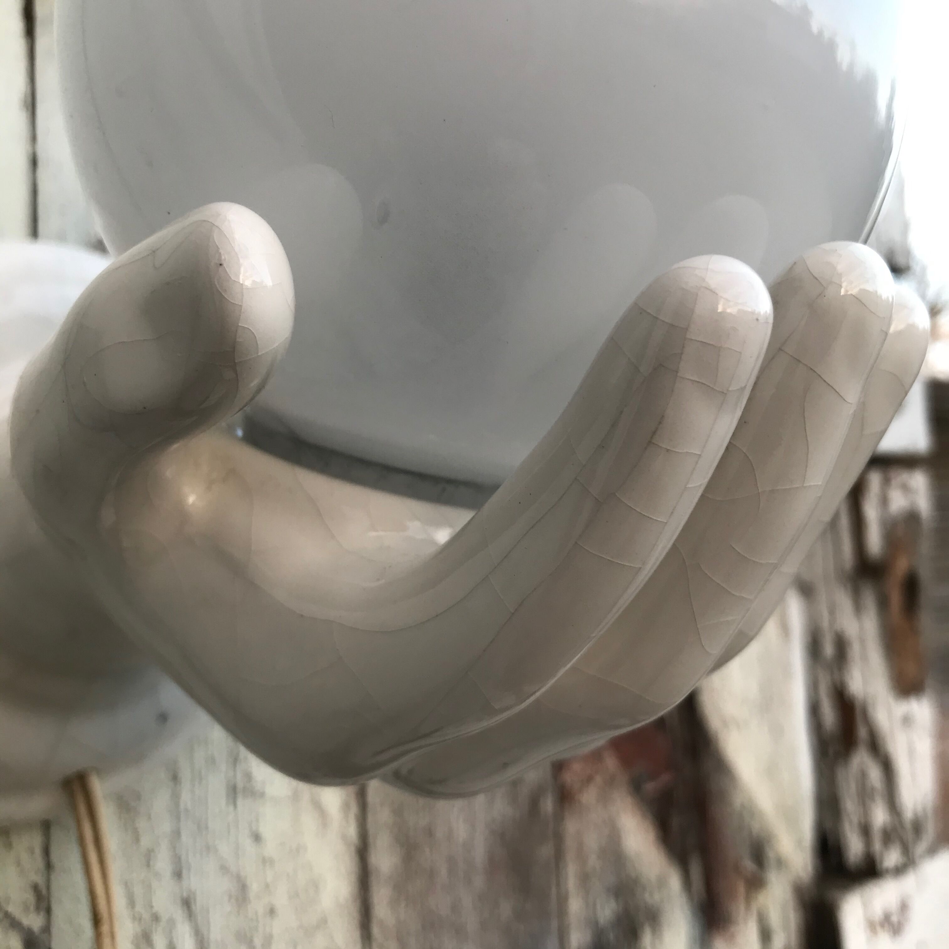 Hand-shaped ceramic wall light