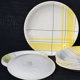 Yellow and white vintage plates Montreal 1960