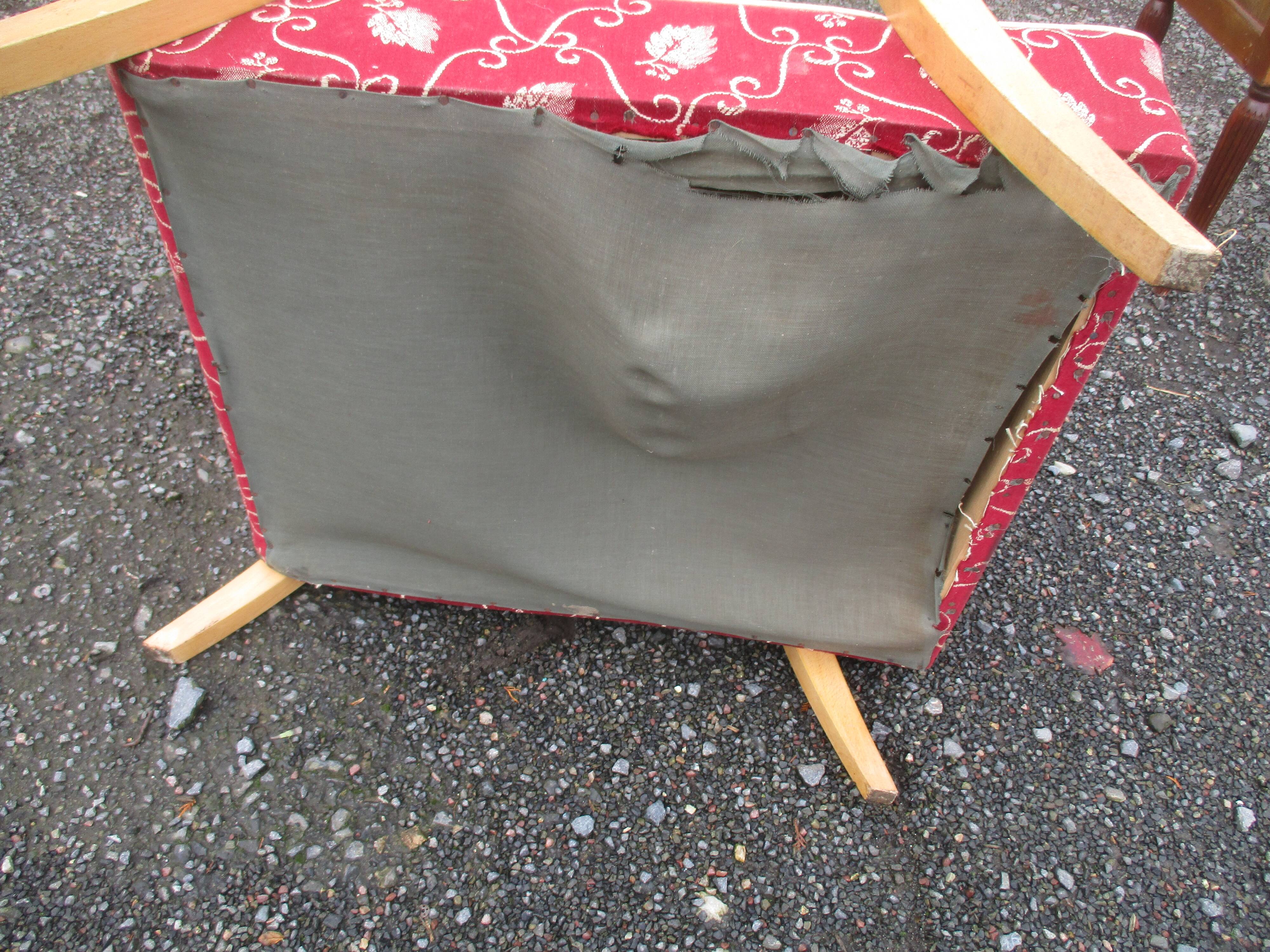 Scandinavian armchair in wood and red fabric