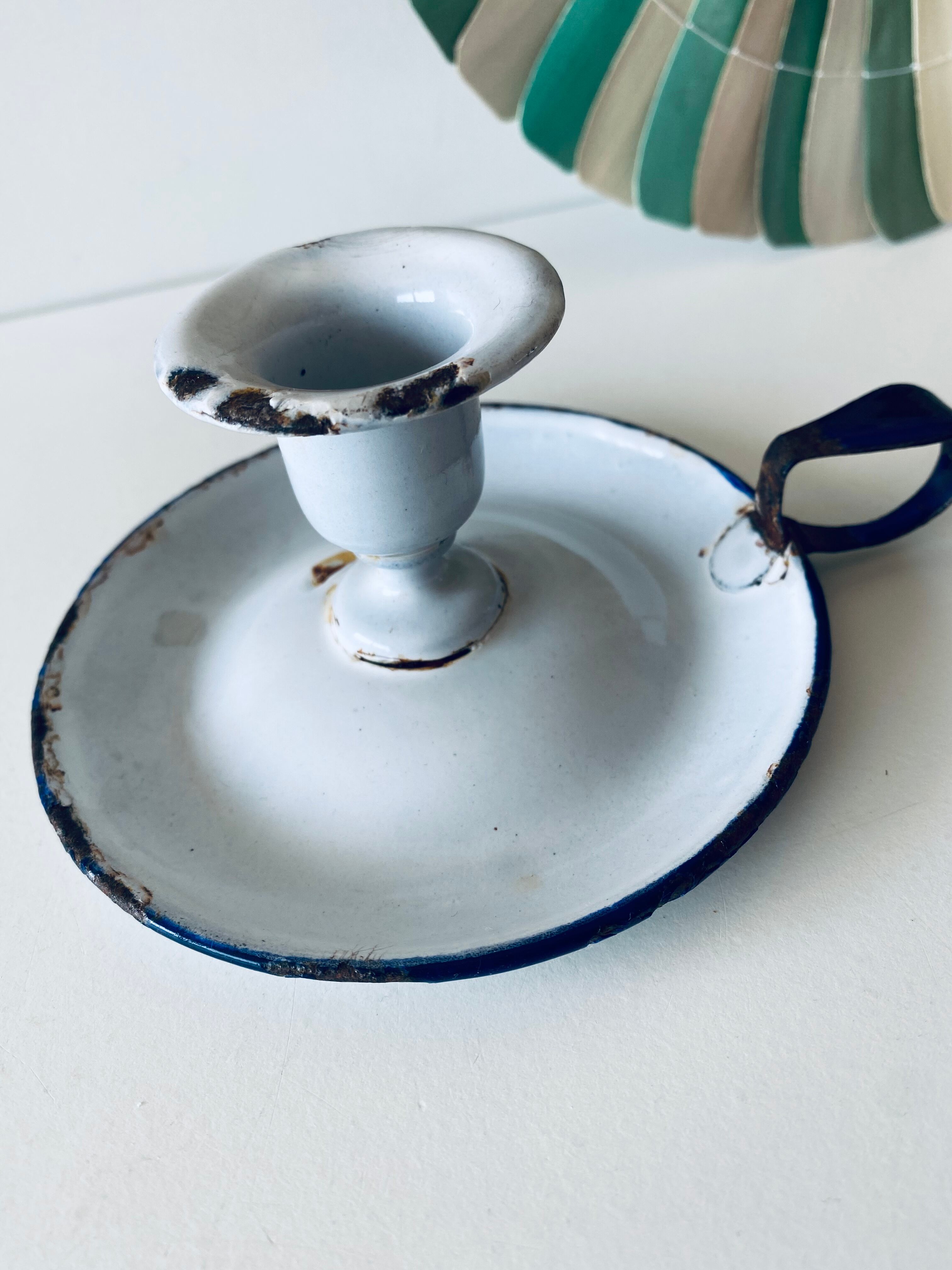 Antique candle holder in white and blue enamelled metal