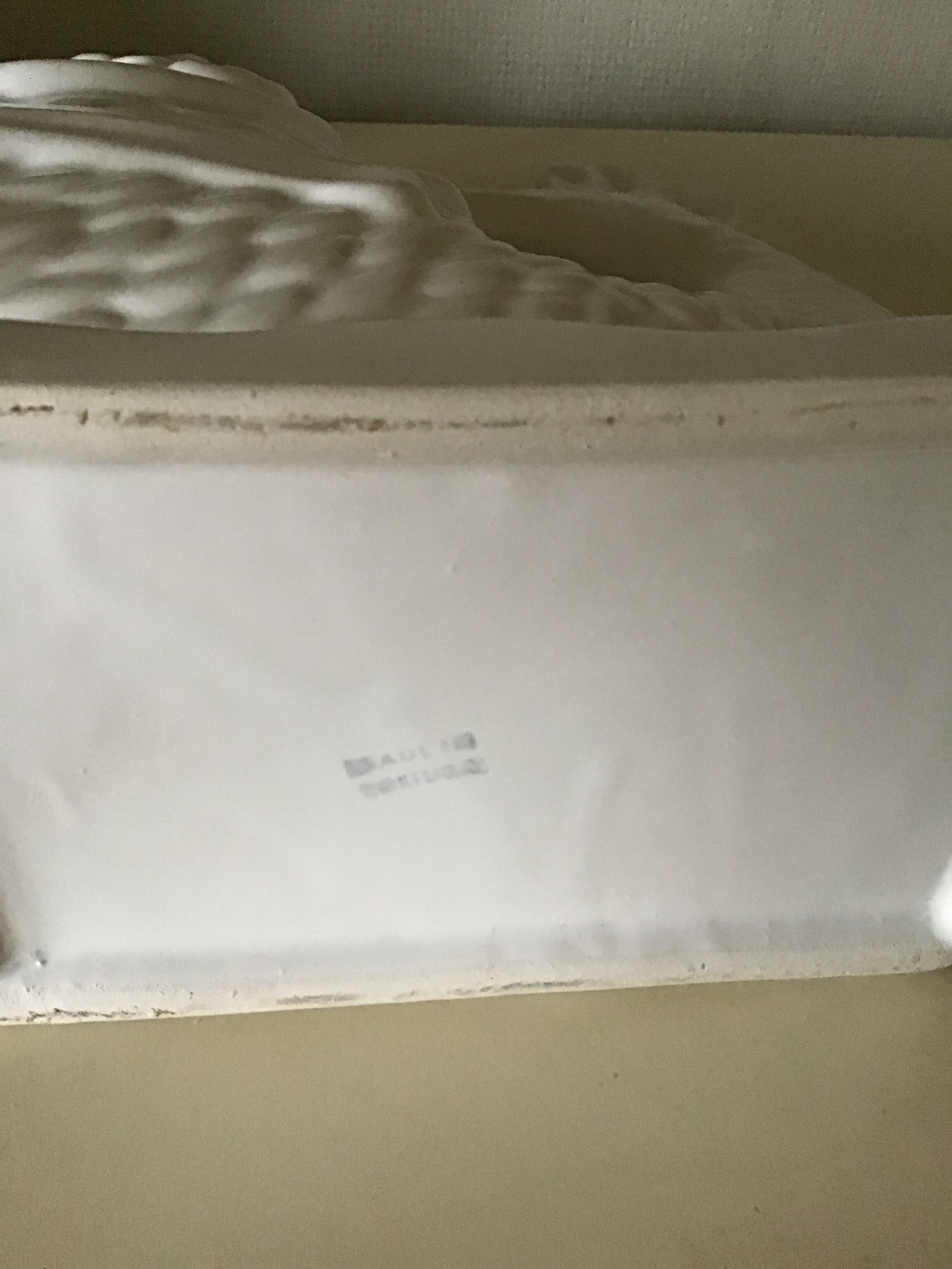 White ceramic vase in the shape of fish