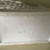 White ceramic vase in the shape of fish