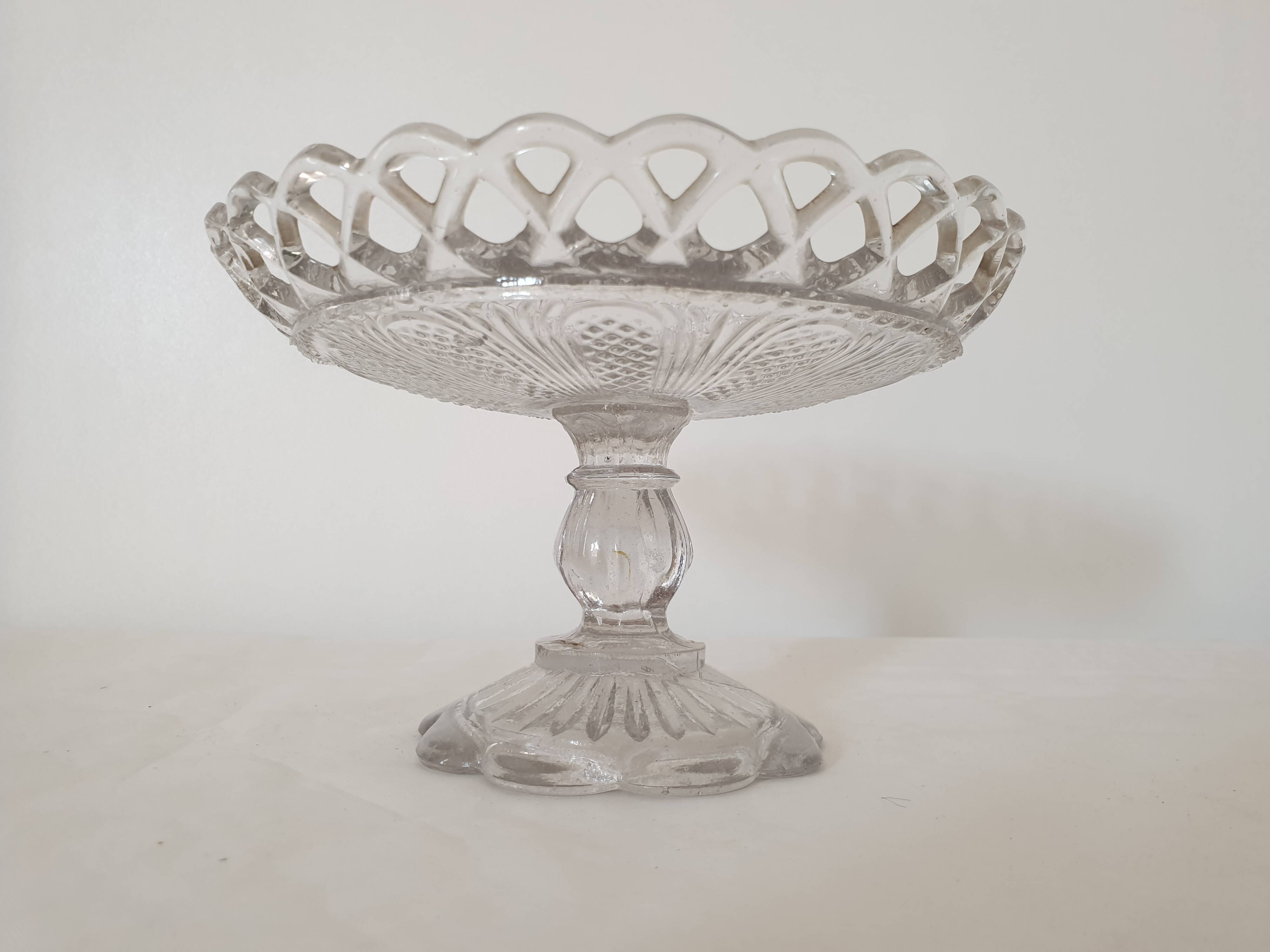 Old cup in molded glass colorless decorative table mignardises