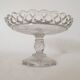 Old cup in molded glass colorless decorative table mignardises