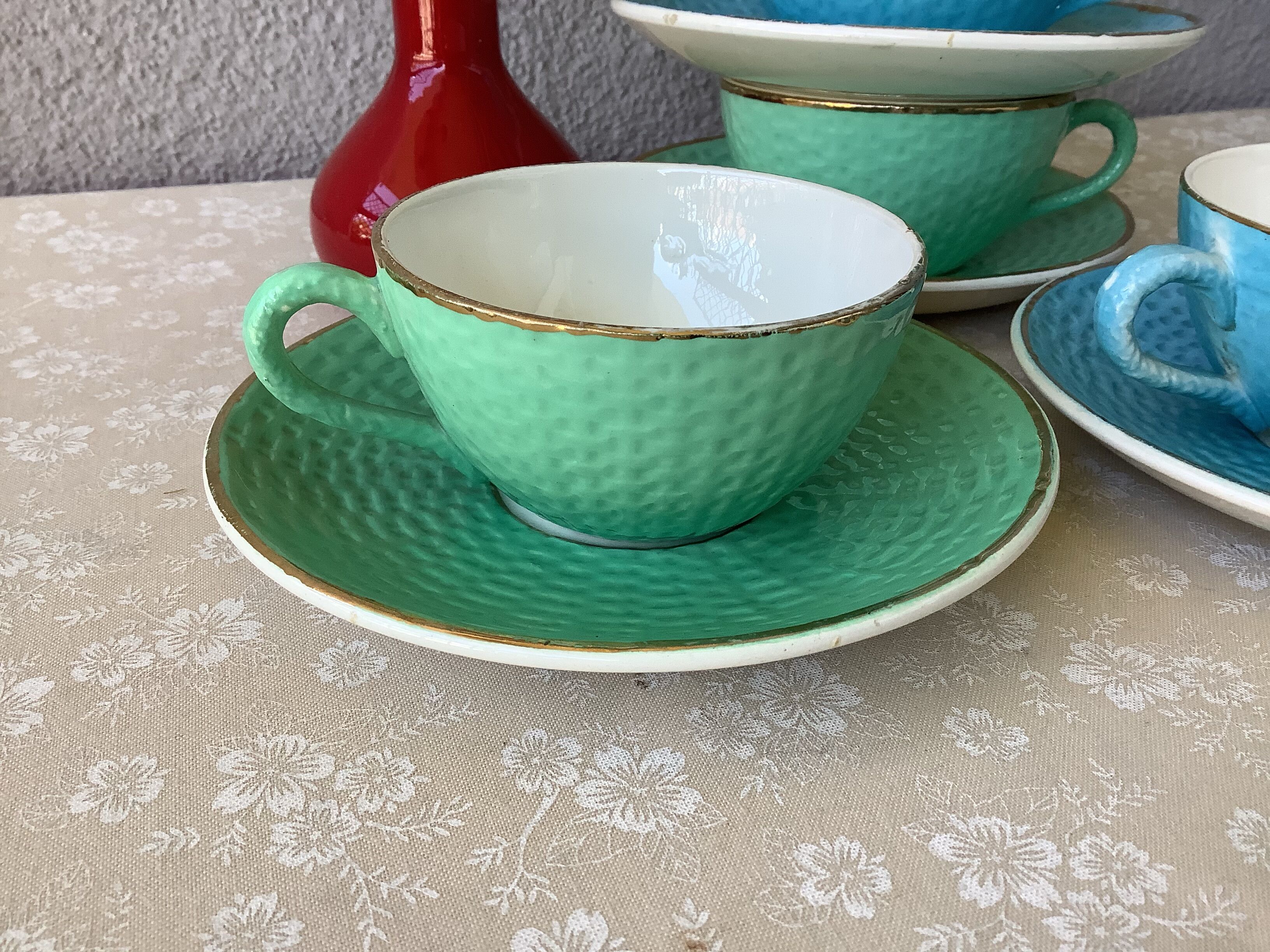 Multicolored Digoin cups looking basket weaving