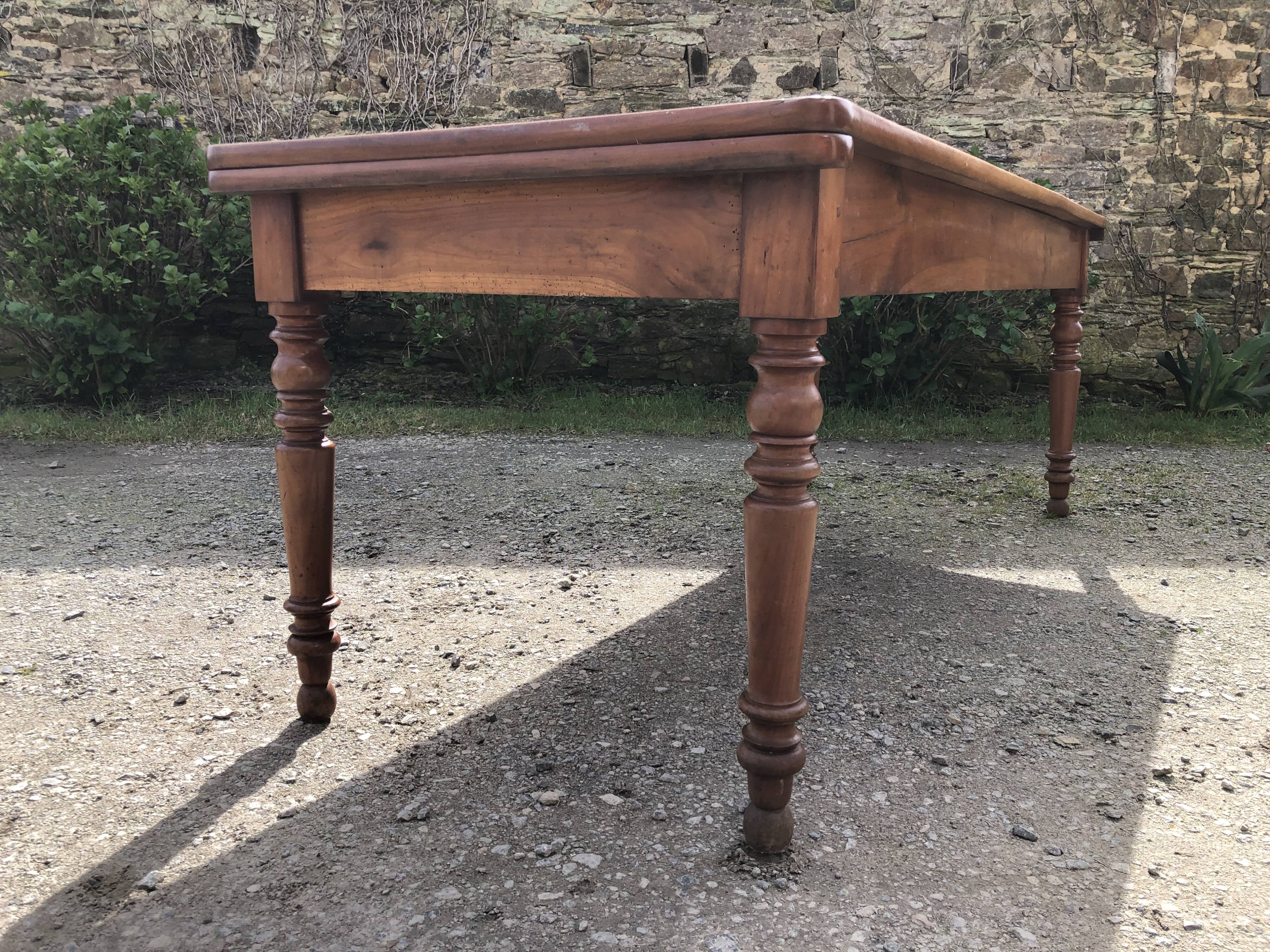 Antique Louis Philippe style farmhouse table in solid cherry wood with its 2 extensions.