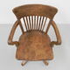 Oak office chair with spring mechanism and armrests