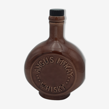Bottle of earthenware marked Angus Mc Kay Whisky