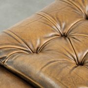 Elegant cowhide English chesterfield ottoman finished with decorative nails