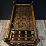Vintage rattan magazine rack on wheels