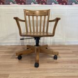Solid wood swivel and reclining armchair.