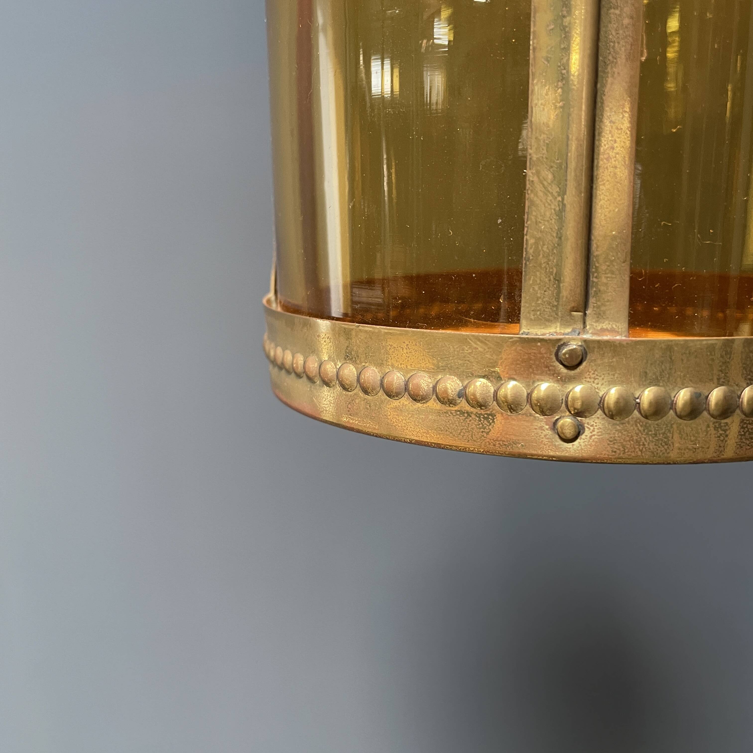 Brass lantern pendant lamp with yellow glass