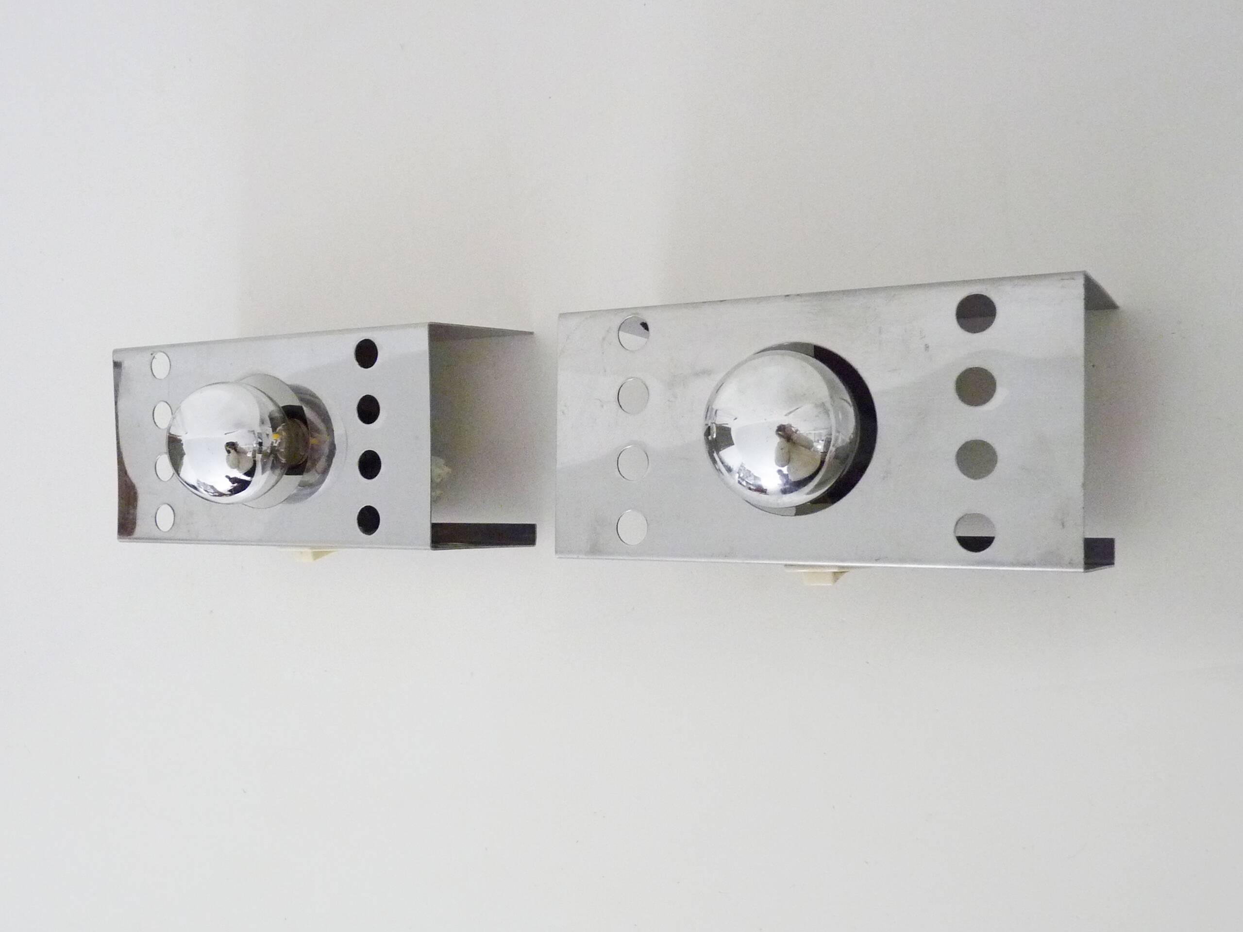 Pair of vintage chrome stainless steel wall sconces. Space Age