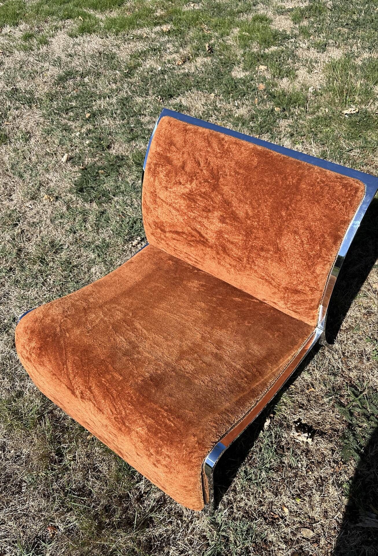 Chrome steel armchair and orange fabric by Vittorio Introini