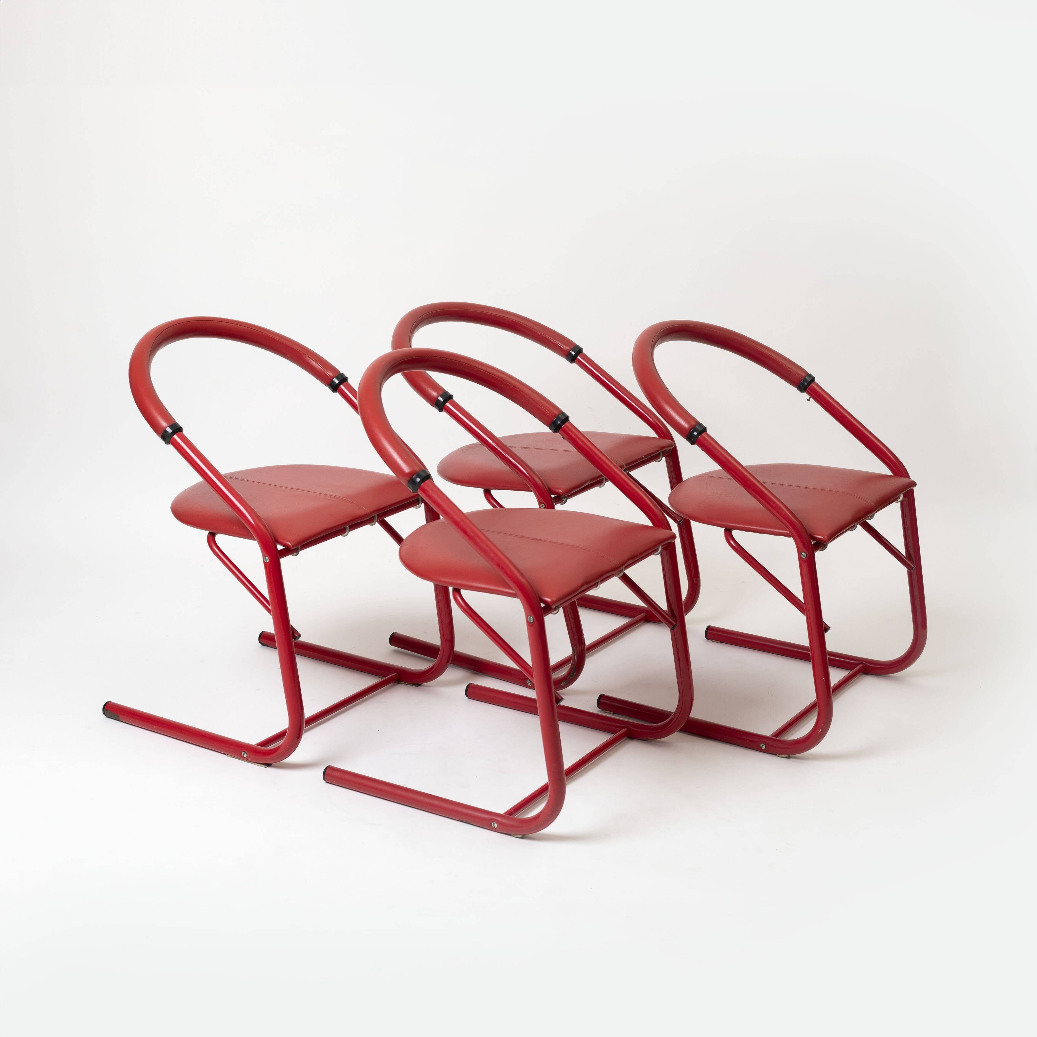 Set of 4 postmodern dining chairs in red lacquered metal and leatherette, italy, 1980s
