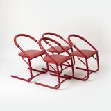 Set of 4 postmodern dining chairs in red lacquered metal and leatherette, italy, 1980s