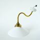 Swan neck wall light in smooth opaline and brass, early 20th century.