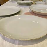 Vintage table service Limoges porcelain white with gold trim.